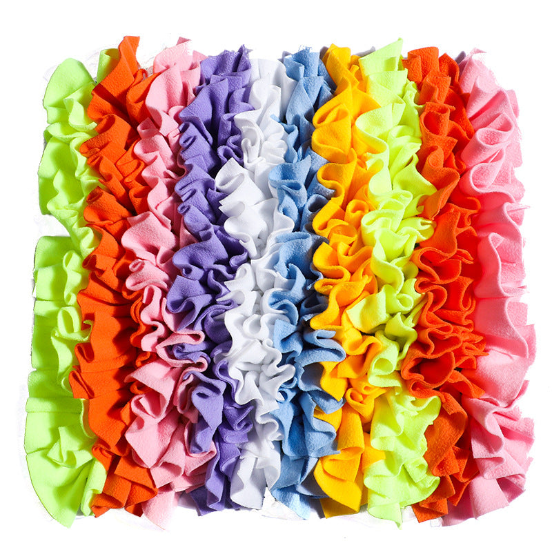 Dog snuffle mat with colorful fabric sections for treat hiding