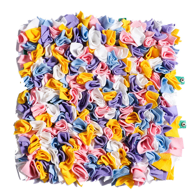 Dog snuffle mat with colorful fabric sections for treat hiding