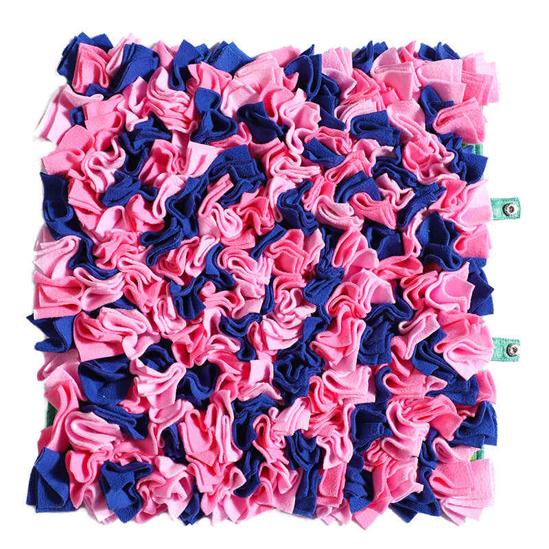 Dog snuffle mat with colorful fabric sections for treat hiding