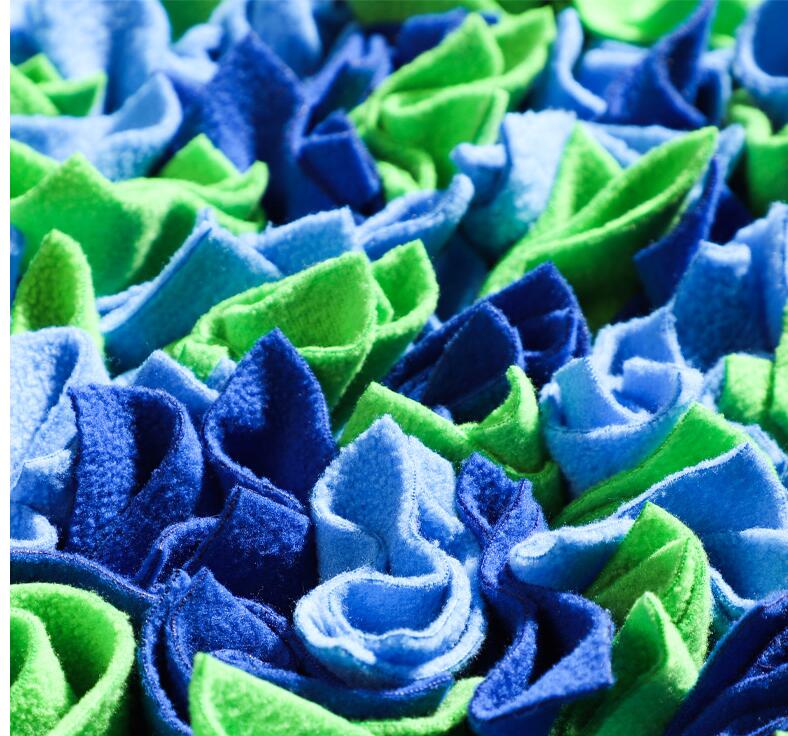 Dog snuffle mat with colorful fabric sections for treat hiding