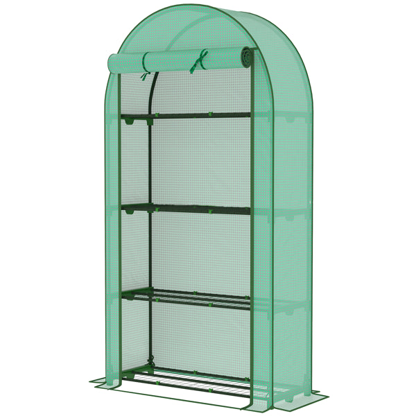 Walk-in greenhouse set up outdoors for growing potted plants