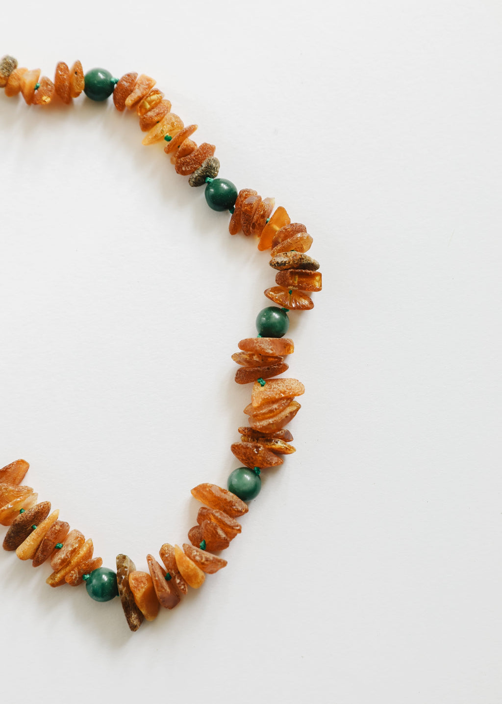 Raw Baltic amber and green jade Pet Necklace close-up