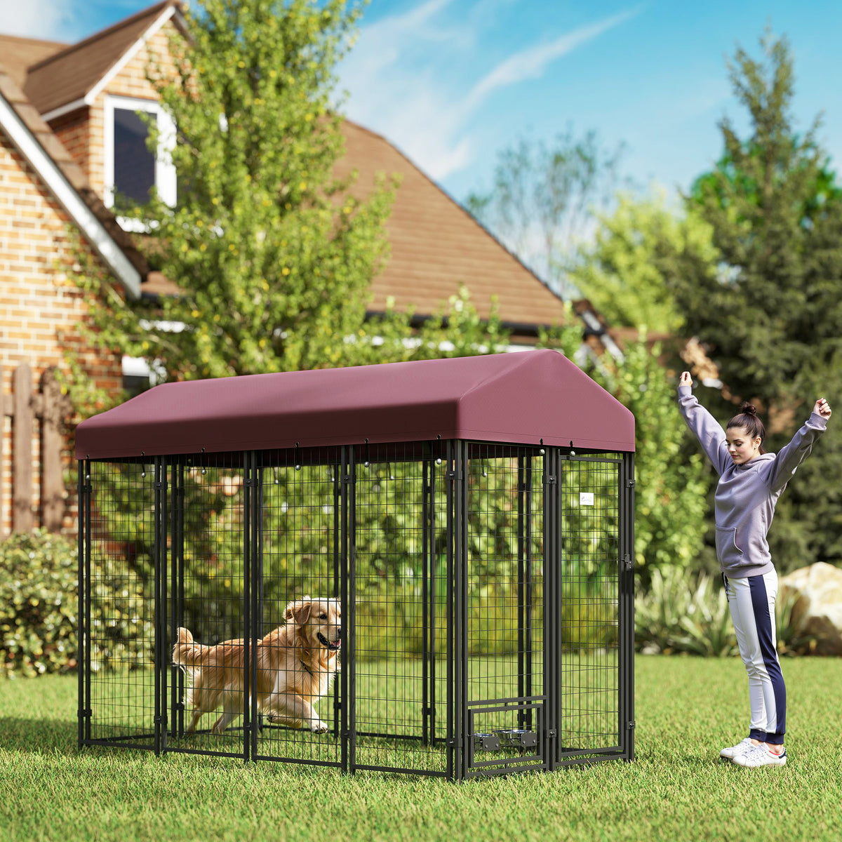 Outdoor dog kennel in red with walk-in access and covered enclosure
