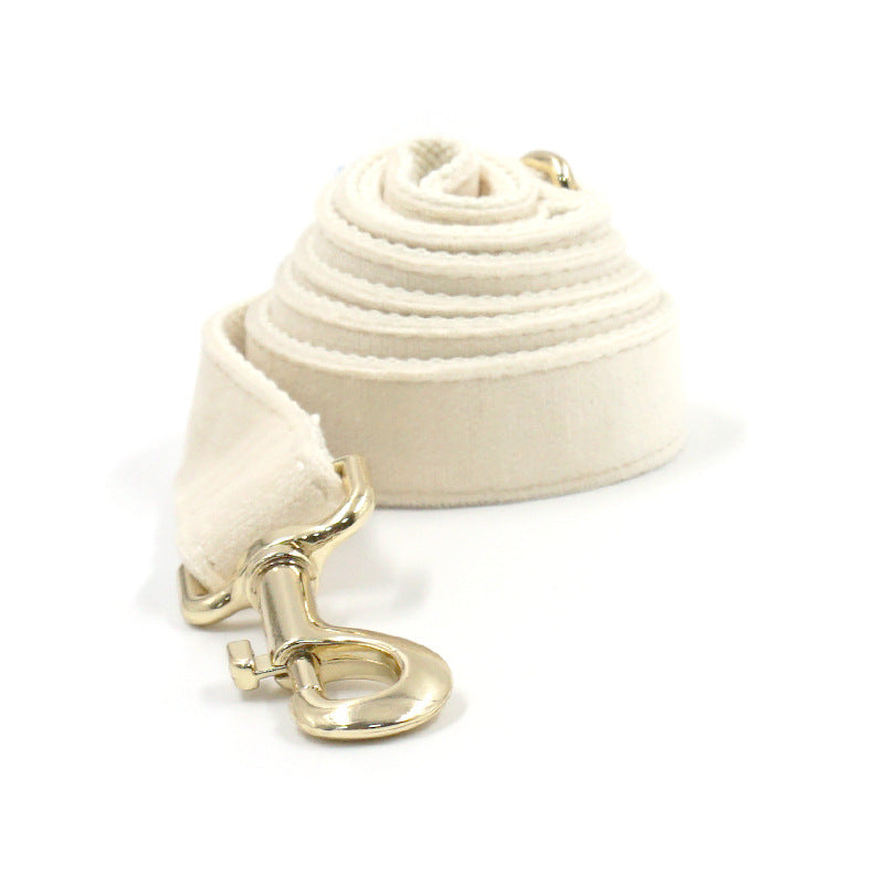 1. Cream dog collar with tufted texture and gold-tone buckle  2. Cream dog collar displayed flat to show its overall design  3. Cream dog collar close-up showing the gold-tone buckle detail  4. Cream dog collar showing the tufted surface texture  5. Cream dog collar worn by a dog during an outdoor walk  6. Cream dog collar displayed alongside coordinating pet accessories
