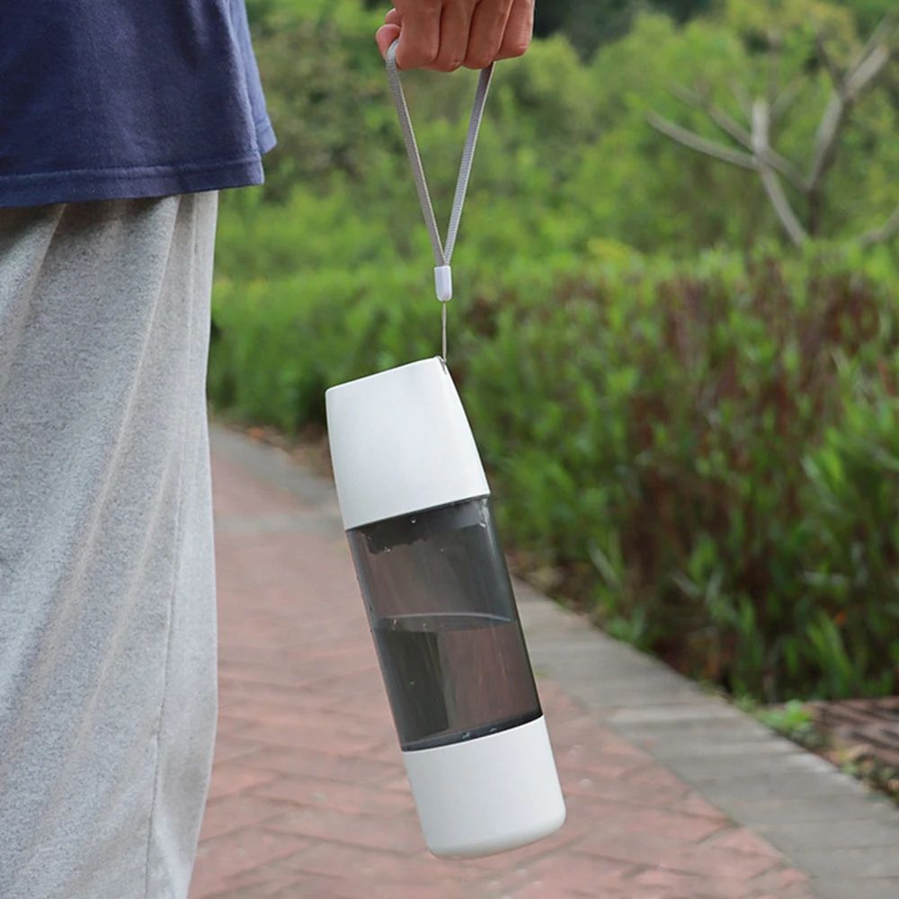 Portable dog water bottle with integrated pet drinking bowl